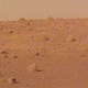 A zoomed-in view of the Elysium Planitia horizon, showing some rather large boulders in the background.